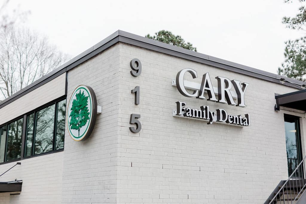 Picture of the Cary Family Dental Practice sign on the outside of the building