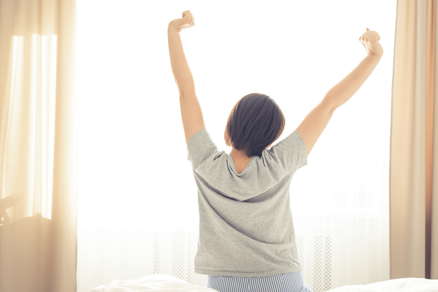 Woman Stretching after a great night sleep