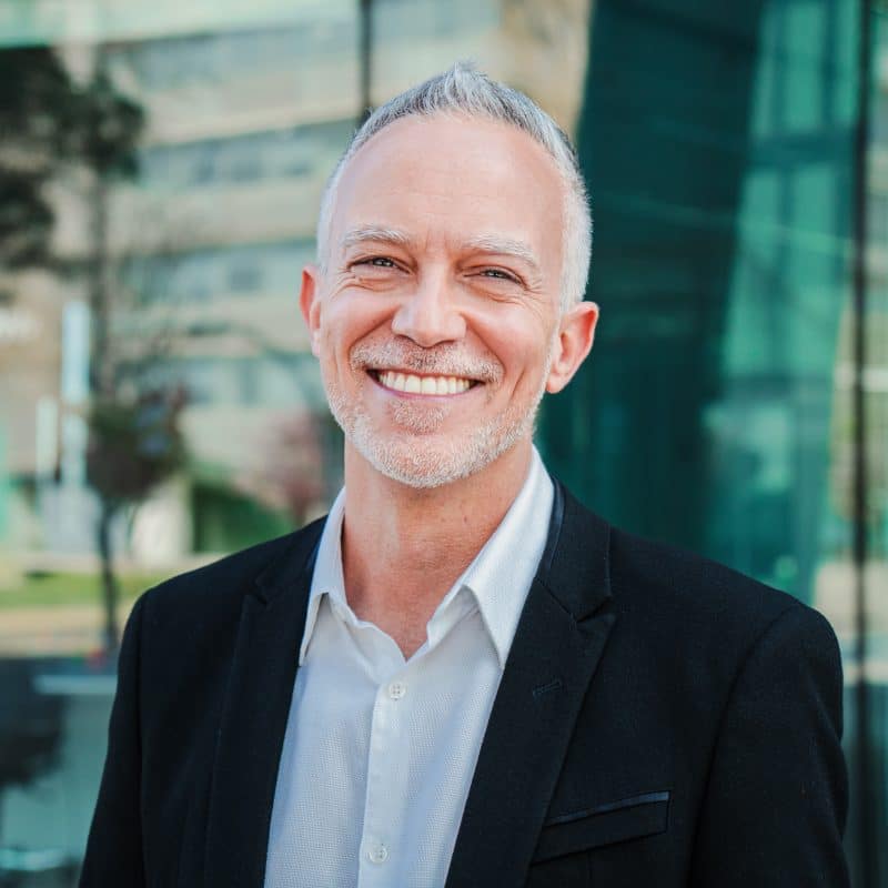 smiling businessman, showing his new veneers